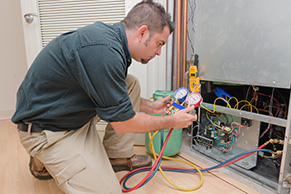A man checking a home HVAC system