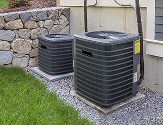 Two outdoor AC units that can be serviced by SAC Mechanical