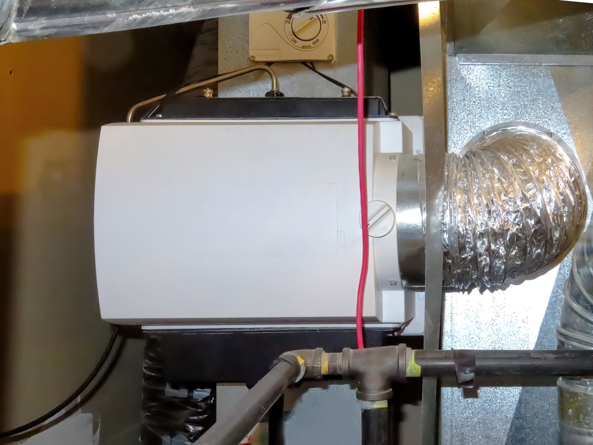 Photo of a furnace-mounted whole-house humidifier in a Longmont home.